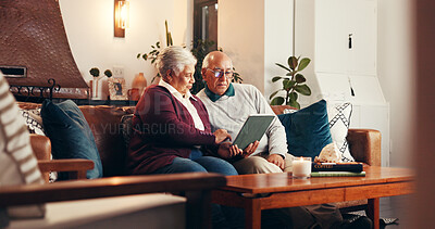 Buy stock photo Home, tablet and senior couple on couch, bonding together and conversation in living room. Apartment, pensioner and old man on sofa, woman and relationship with tech, social media and online reading