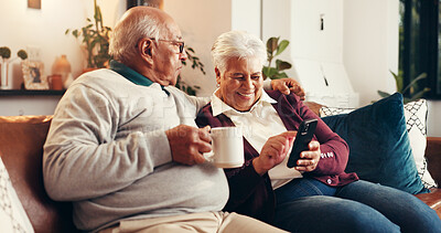 Buy stock photo Home, smartphone and senior couple on couch, bonding together and digital app in living room. Apartment, cellphone and old man on sofa, woman and relationship with tech, social media and conversation