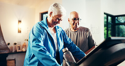 Buy stock photo Old couple, treadmill and smile for fitness in home, walk and support with training in retirement. Senior man, woman and discussion with gym equipment, machine and steps with exercise in house