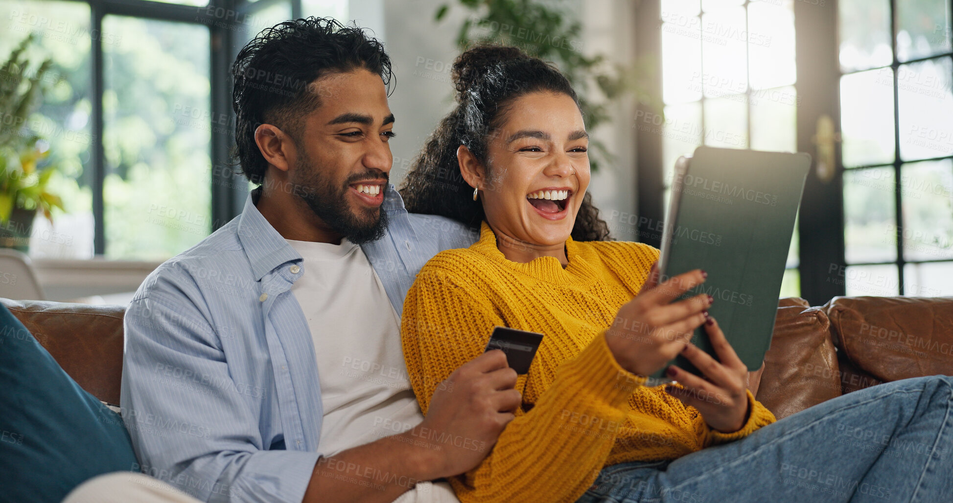 Buy stock photo Happy couple, credit card and tablet on sofa for online shopping, sale and easy payment in living room. People, digital banking and excited with fintech app, deal or discount with ecommerce at house