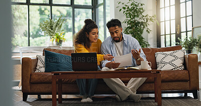 Buy stock photo Home, couple and discussion with paperwork, financial analysis and checking info with laptop or app. Asset management, online and people with documents in living room, bills and planning in house