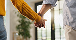 Love, holding hands and care with couple in house for romantic connection, support and trust. Marriage, commitment and relationship partner with man and woman in living room of home for loyalty