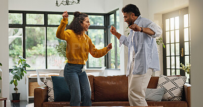 Buy stock photo Happy couple, dancing and bonding in living room, home and love with celebration for goals. People, man and woman with moving, rhythm and playful smile for partnership, relationship or care in house