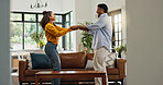 Happy couple, dancing and excited in living room, home and love with celebration for goals. People, man and woman with moving, rhythm or holding hands for partnership, relationship or care at house
