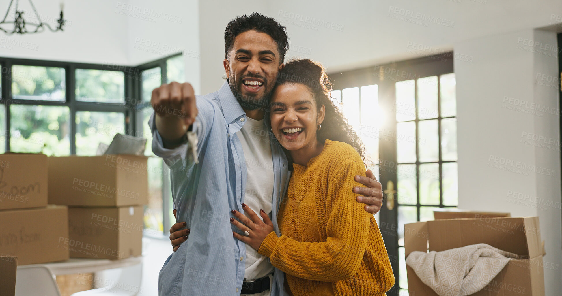 Buy stock photo Hug, keys and moving with couple in new home for property, support and mortgage success. Real estate investment, celebration and relocation with portrait of man and woman in living room of house