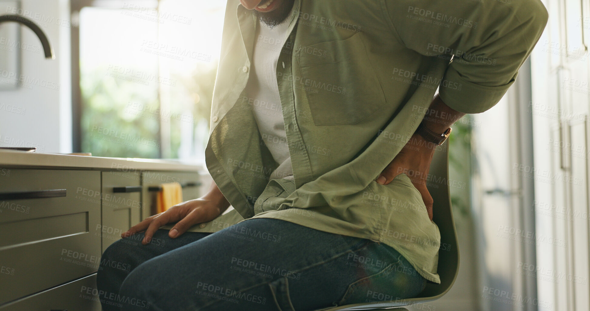 Buy stock photo Hands, man and back pain in kitchen at house for muscle tension, bad posture and joint strain. Male person, discomfort and spine injury with bone fracture, fibromyalgia and inflammation for arthritis