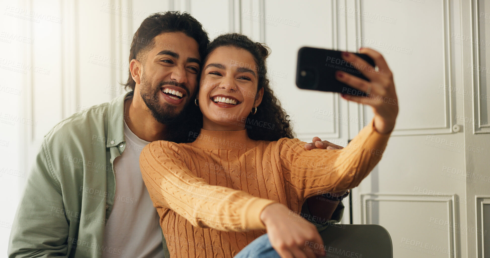 Buy stock photo Bonding, couple and selfie in house, together and affection for memory on social media and laughing. Happy, man and profile picture with woman in home, smile and photography in apartment or romance