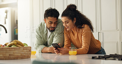 Buy stock photo Home, smile and couple in kitchen, smartphone and typing with social media, connection and texting. Woman, orange juice and cellphone with communication, internet and message to contact, man or email