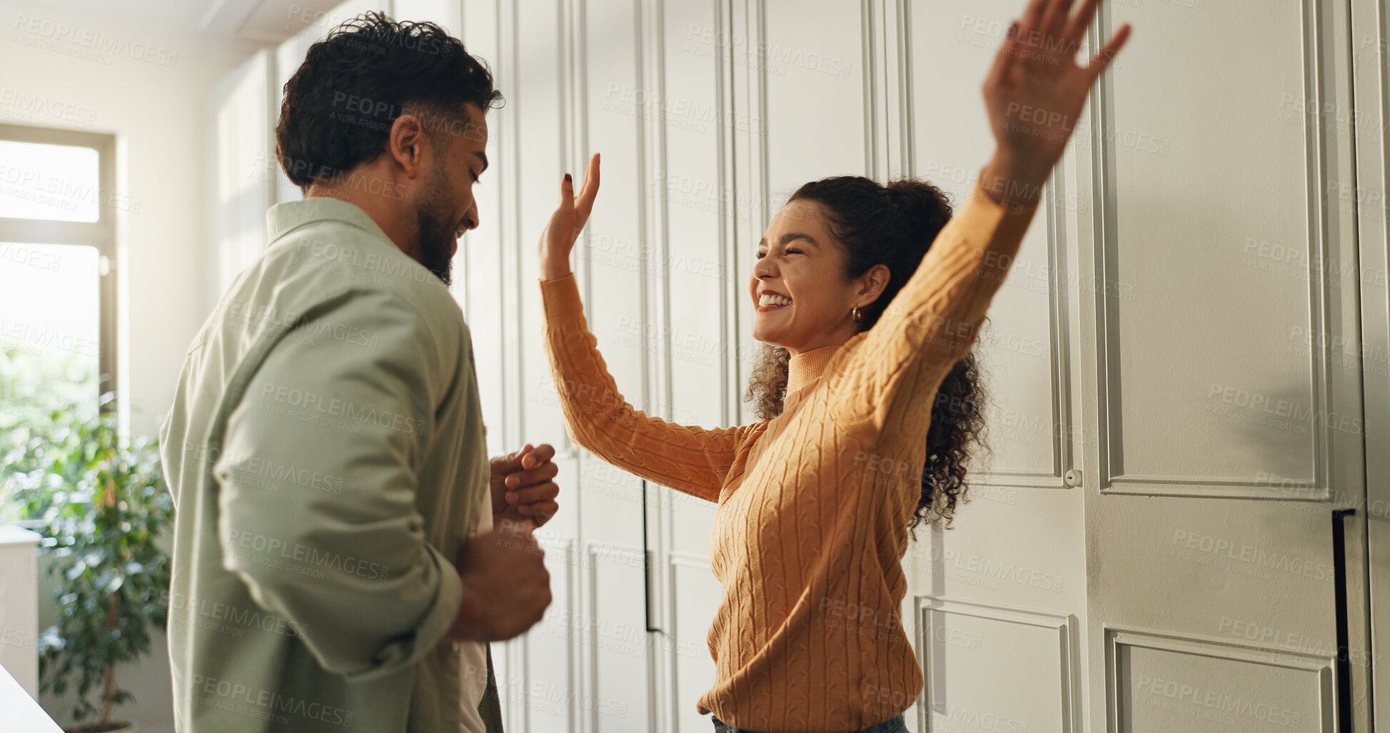 Buy stock photo Dancing, couple and fun in new home, laughing and celebration for milestone in kitchen or apartment. Happy, man and moving in with woman, love and achievement of mortgage, groove and rhythm in house