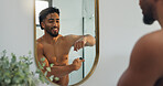 Mirror, happy and man with deodorant in bathroom for fresh scent, grooming and hygiene in home. Morning routine, reflection and person with antiperspirant, spray and fragrance for aroma or sweat