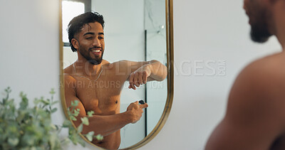 Buy stock photo Mirror, happy and man with deodorant in bathroom for fresh scent, grooming and hygiene in home. Morning routine, reflection and person with antiperspirant, spray and fragrance for perfume or sweat