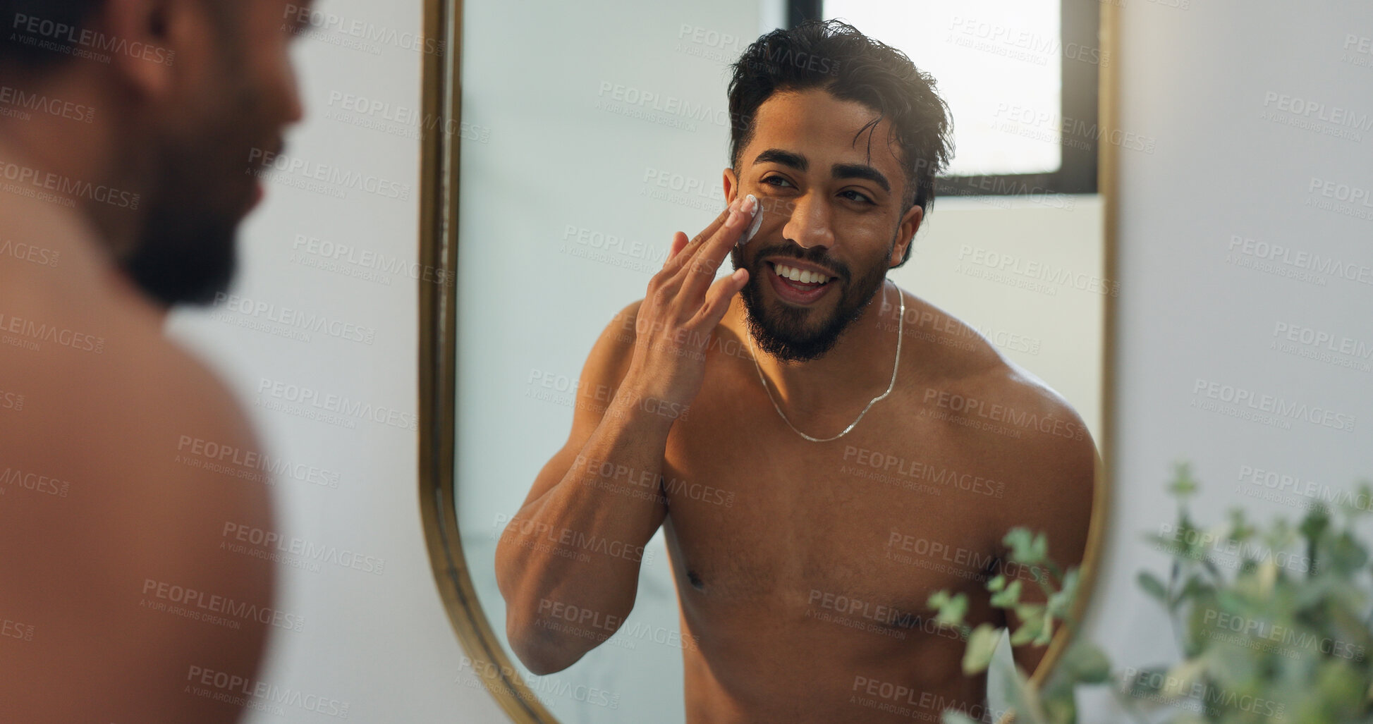 Buy stock photo Beauty, cream and mirror with man in bathroom for skincare, morning routine or moisturizer. Facial treatment, self care and cosmetics with person and lotion in home for collagen, dermatology and glow
