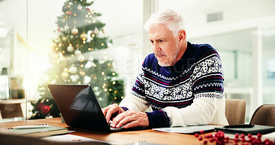 Buy stock photo Christmas, office and mature businessman on laptop for finance report, proposal and check profit for holiday. December, corporate and person on computer for payroll bonus, financial review and budget