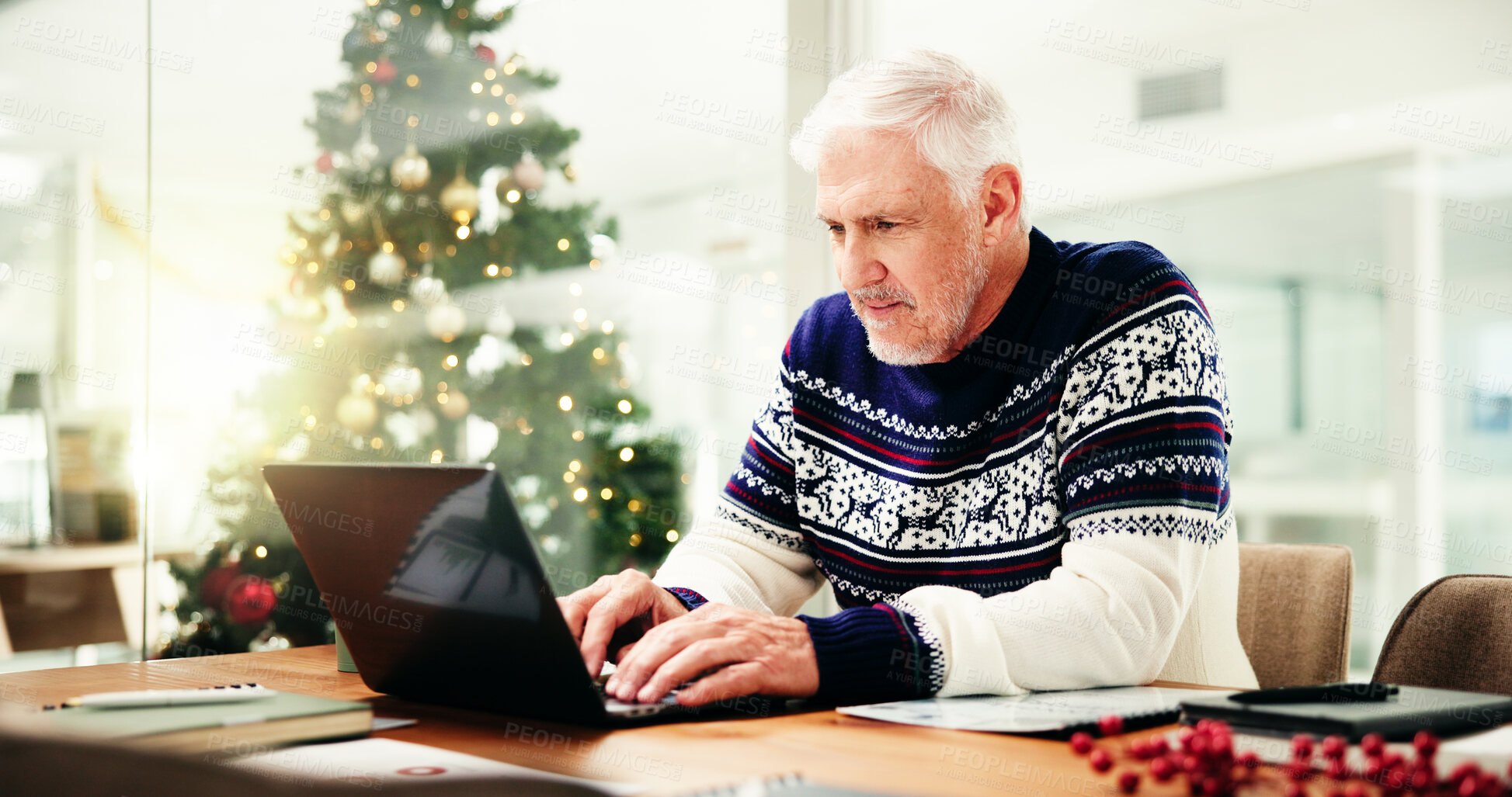 Buy stock photo Christmas, office and mature businessman on laptop for finance report, proposal and check profit for holiday. December, corporate and person on computer for payroll bonus, financial review and budget