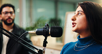 Buy stock photo Podcast, studio and woman with mic talking for radio show, interview and broadcast subscription. Influencer, content creation and man with guest for recording, conversation and host on live stream