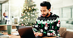 Christmas, typing and businessman on laptop in office for finance report, proposal and profit for holiday. December, professional and person on computer for payroll bonus, financial review and budget