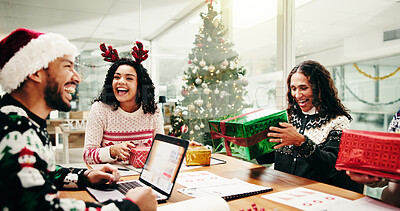 Buy stock photo Christmas, laugh and business people with gift in office party for holiday celebration. Xmas, happy group and workers with present, surprise and excited for festive season with funny joke in meeting