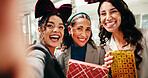 Christmas, business women and selfie in office with gift at festive celebration with POV. Team, portrait and photo of friends with xmas present for holiday, party and laugh with social media post
