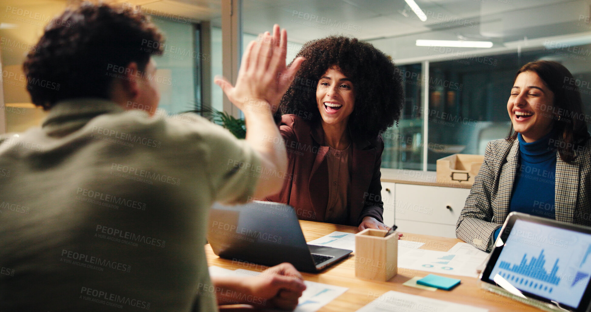 Buy stock photo Happy, people and high five in office at night of good news, celebration and finance growth. Staff, tablet and success for team, profit graphs and deadline achievement with support of investment deal
