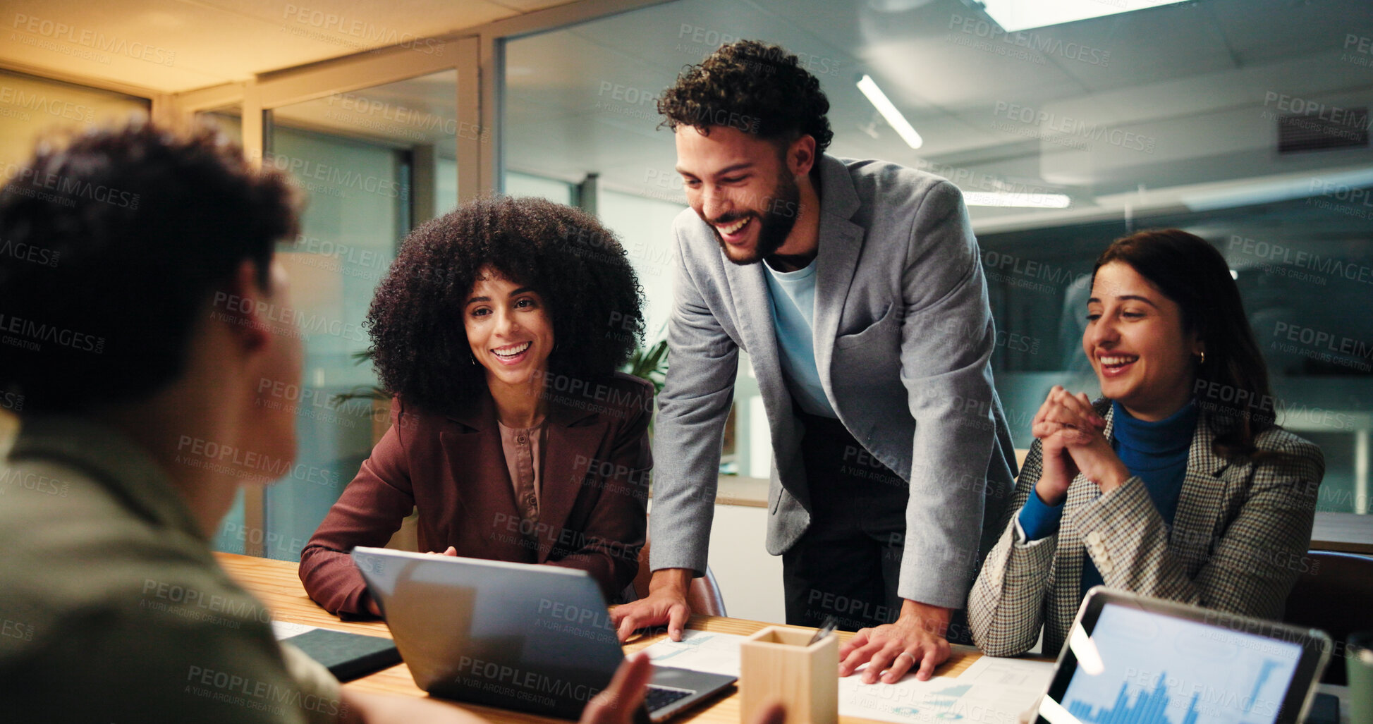 Buy stock photo Laughing, group and colleagues with laptop, data analysis or happy with performance report at night. Working late, collaboration and people with tablet for stats, screen and meeting with documents