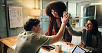 People, meeting and high five in office at night for good news, celebration and finance growth. Employees, laptop and success for teamwork, profit increase and deadline achievement of investment deal