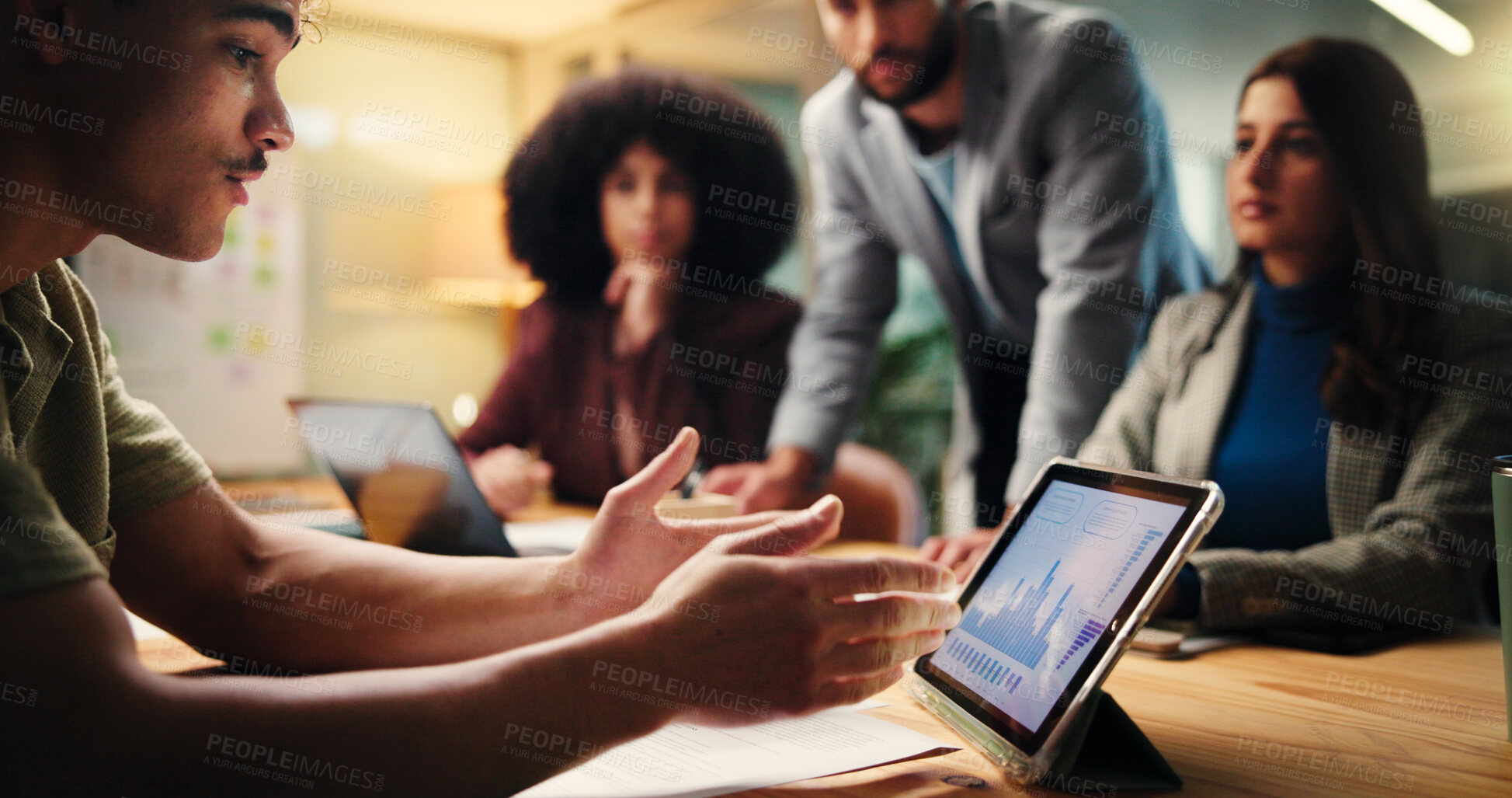 Buy stock photo Meeting, discussion and man with tablet, data analysis and report for ad campaign, people and night. Working late, collaboration and group with tech for stats, screen or planning with graphs or chart
