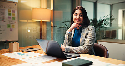 Buy stock photo Laptop, portrait and statistics with business woman in office at night for social media analytics. Computer, development and smile of happy Indian employee at desk in workplace for evening deadline