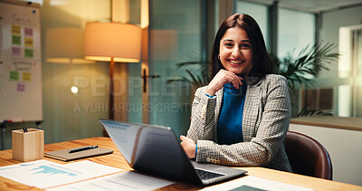 Buy stock photo Laptop, portrait and smile of business woman in office at night for social media analytics. Computer, development and statistics with happy Indian employee at desk in workplace for evening deadline