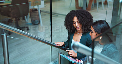 Buy stock photo Business women, tablet and talk in office for planning, financial report and review budget. People, discussion and digital tech on stairs for teamwork, finance feedback and information for investment