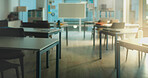 Empty room, education and furniture of classroom on campus for lecture, college and learning space. University Interior, architecture and back to school with desk and whiteboard for flare and academy