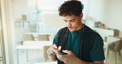 Buy stock photo Cellphone, communication and man in classroom at university with networking, mobile app or social media. Technology, contact and male student with phone for texting on website in college campus.