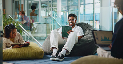 Buy stock photo Man, student and reading on tablet at college for research, prepare for exam and study in lounge. Person, digital and project feedback, online results and education agenda for university assignment
