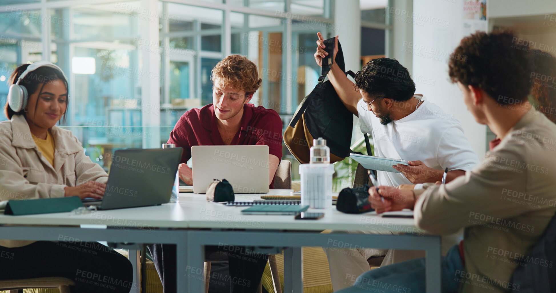 Buy stock photo People, students and friends with tech for college, study group and help in cafeteria. Men, woman and talk with laptop, scholarship and assignment research for university project or online learning