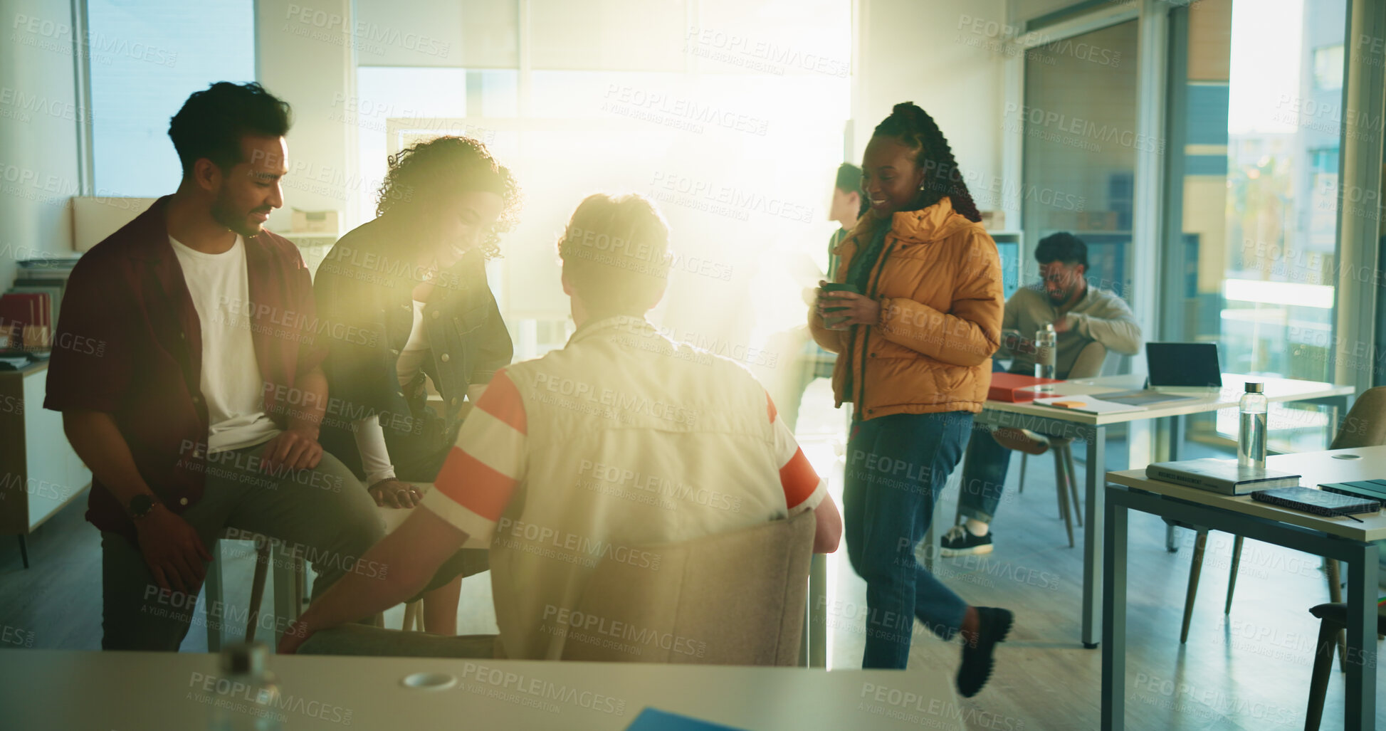 Buy stock photo Education, student and group in classroom, talking or preparing for exam, lens flare and discussion. Happy, people and conversation with classmate in college, together and help for test and advice