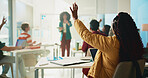 Student, woman and raised hand in classroom at university with learning, notes and question for education. Person, back and attention with scholarship, gesture and solution with discussion at college