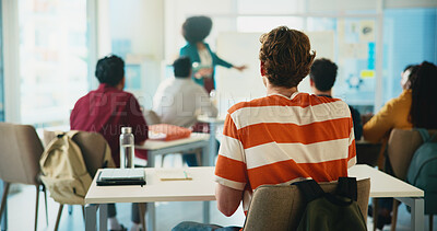 Buy stock photo Listening, professor and lecture with students in classroom for college, learning and lesson. University, education and teaching with back of person on campus for assignment, study and curriculum