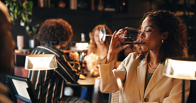 Buy stock photo Woman, night and drinking with wine in restaurant for fine dining, dinner or anniversary in cafe. Female person, alcohol and glass with couple on date for romance, valentines day or evening out