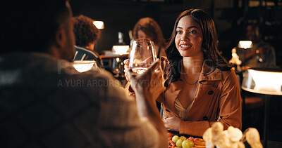 Buy stock photo Couple, date and wine with toast in restaurant at night for bonding, celebration and conversation. Alcohol, romance and love for people drinking together for anniversary, cuisine or relationship chat