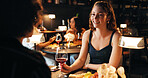 Woman, wine glass and talk on date at restaurant with partner, bonding or love in relationship. Girl, couple and happy for alcohol beverage in discussion, relax and drinks on romantic night at diner