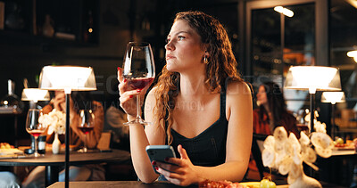 Buy stock photo Wine, woman and waiting with phone in restaurant for dinner date, late appointment and mobile chat. Night, drink and person with smartphone in diner for networking, texting location and notification