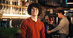 Bartender, man or smile at counter in pub for friendly welcome, customer service or hospitality. Small business, manager and confidence at restaurant with portrait, ready for happy hour or management
