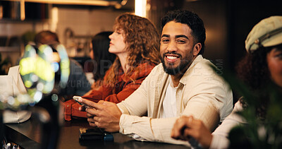 Buy stock photo Happy man, waiting and bartender with phone for drink or hospitality service in local pub. Male person, group or customer with smile or mobile smartphone for night out, review or late evening in cafe