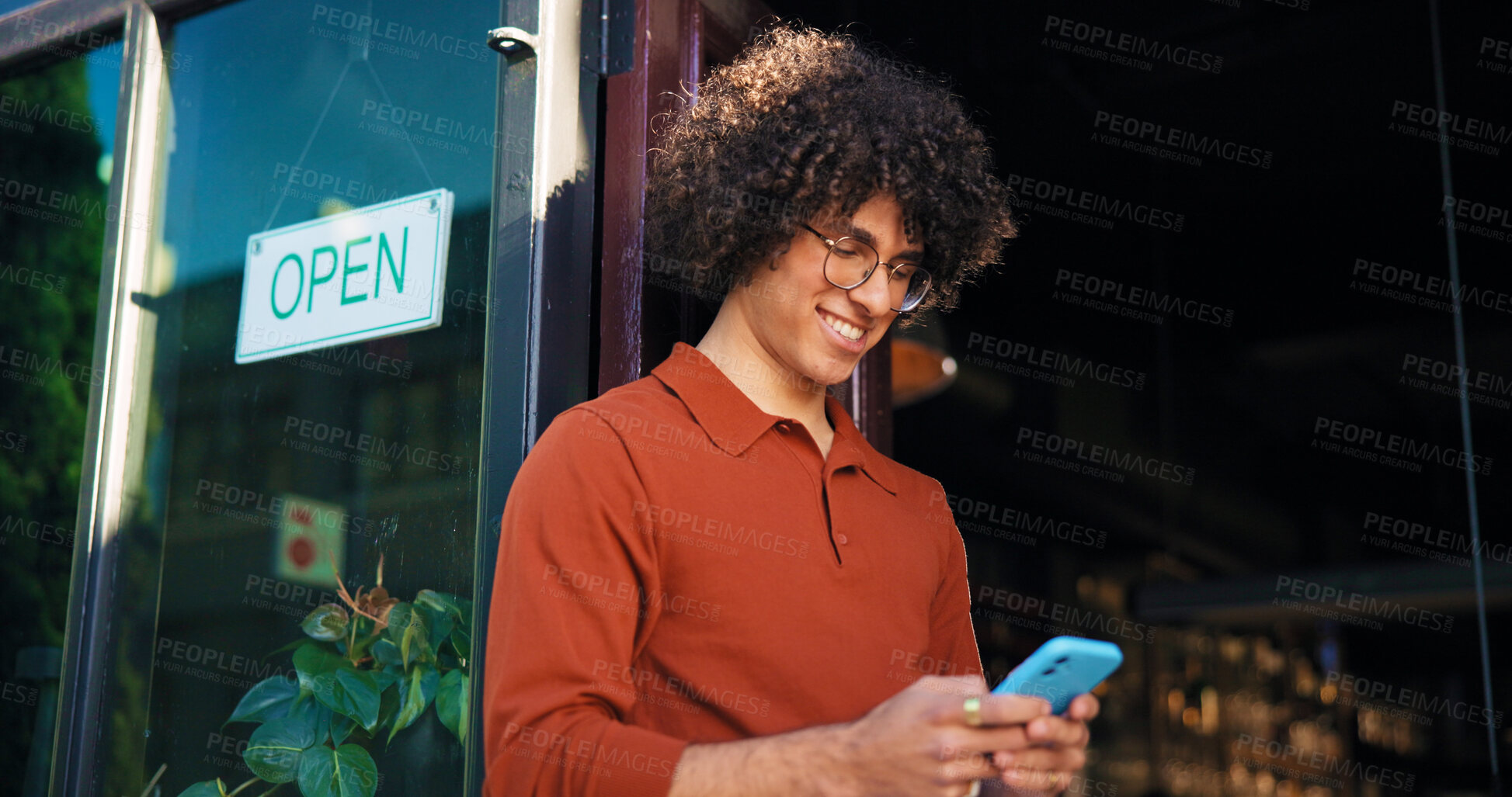 Buy stock photo Phone, cafe and smile with man at front door for delivery tracking, small business owner and contact. Restaurant manager, online order and coffee shop schedule with person for inventory update
