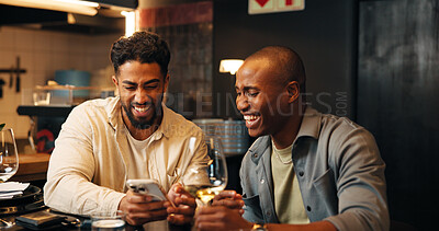 Buy stock photo Wine, laugh and men with phone in restaurant for social media, online message and conversation. Nightclub, talking and friends with alcohol drinks on smartphone for reunion, hangout and weekend