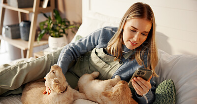 Buy stock photo Girl, phone and puppy on bed, home and texting with care, bonding and web chat in morning. Woman, dog mom and pet animal with smartphone, scroll or contact on mobile app for social media at apartment