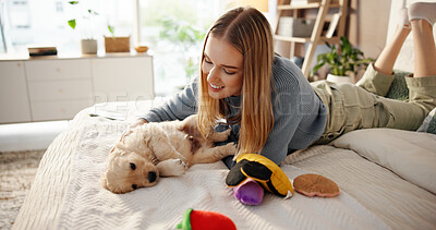 Buy stock photo Happy, playing and woman with puppy on bed for learning, development and bonding after adoption. Pet owner, bedroom and person with Golden Retriever dog for relaxing, relationship and animal care