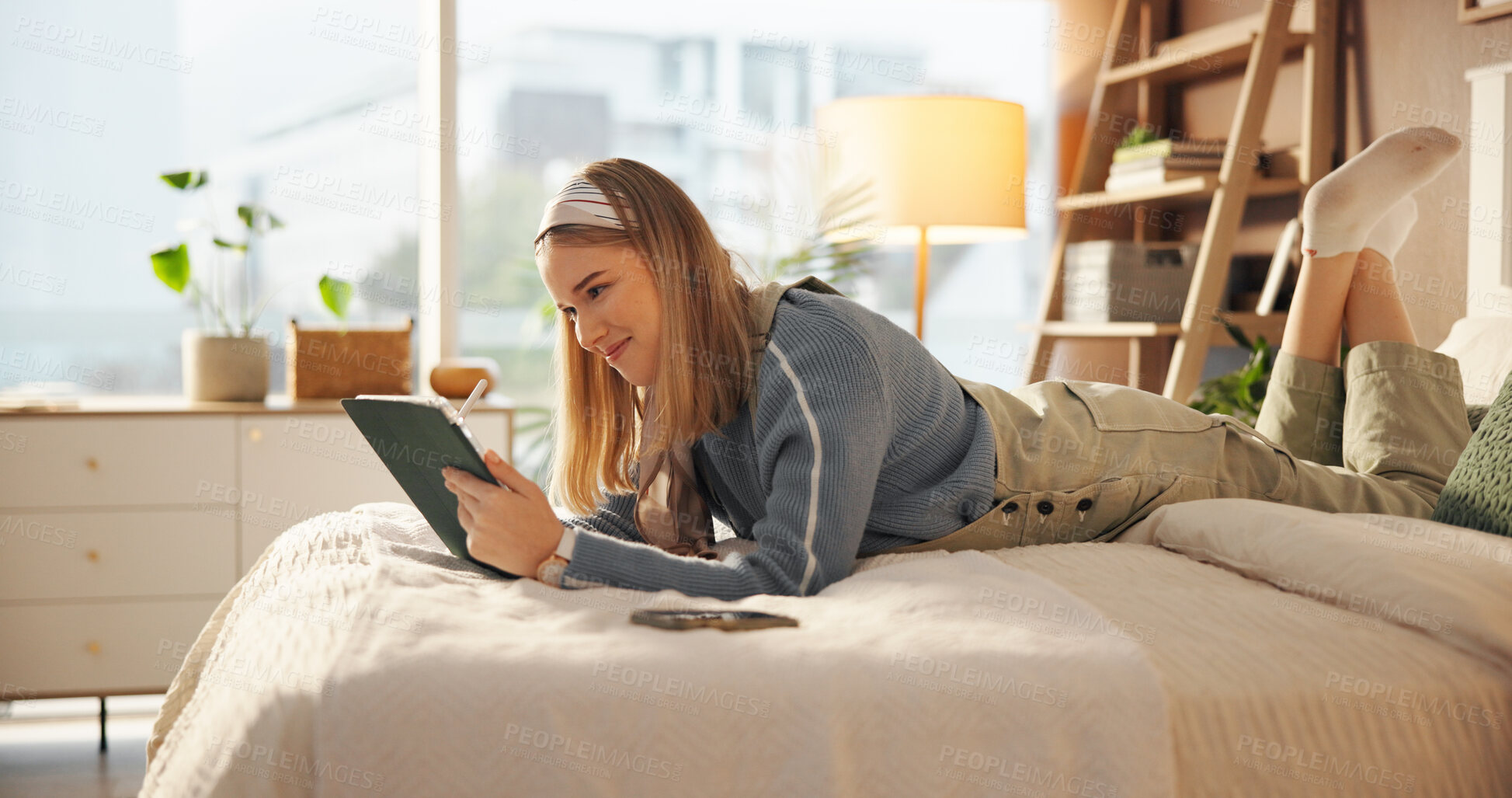 Buy stock photo Tablet, art and woman on bed with stylus for drawing, hobby or creative project on app for college. Technology, bedroom and student with pen for graphic design assignment for university in home.