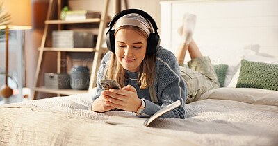 Buy stock photo Happy, bed and woman with headphones and notebook for relaxing, writing in journal and social media. Bedroom, chill and person with phone listening to audio, radio and streaming music for inspiration