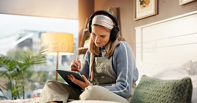 Buy stock photo Tablet, headphones and woman on bed with stylus for drawing, hobby or creative project for college. Technology, music and female student with pen for graphic design assignment for university in home.