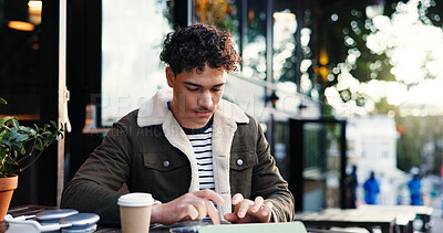 Buy stock photo Remote work, tablet and man at outdoor cafe as social media marketer with research. Technology, coffee shop and serious freelancer typing email for online engagement or campaign promotion in city